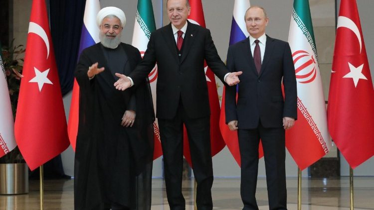 صورة من الأرشيف للرؤساء بوتين، إردوغان وروحاني