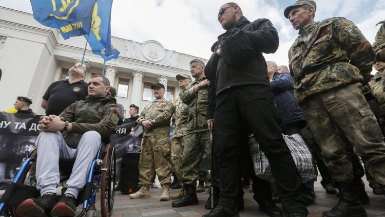 Volunteer fighters in Ukraine's Donbass region rally in Kiev