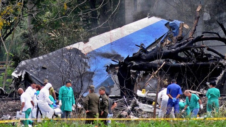 police and military personnel work among the wreckage of the Boeing 737 that crashed shortly after take-off from Havana's Jose Marti airport