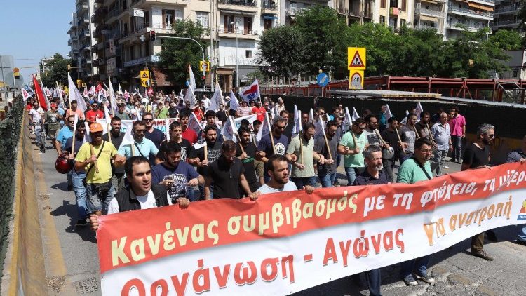Greeks march in Thessaloniki during a general strike called by labour unions
