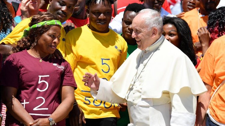 Pope Francis and a group of migrants during a General Audience 
