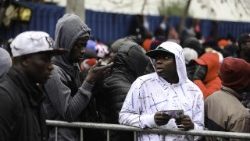 haitian-immigrants-queue-at-the-embassy-to-le-1531855180657.jpg