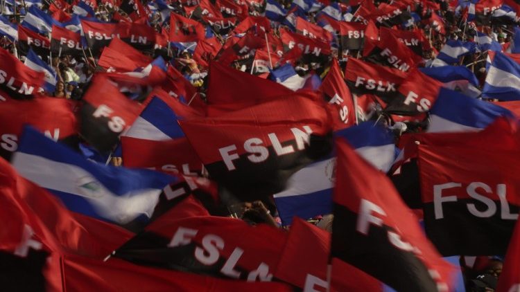 Sandinista sympathizers wave FSLN flags at an anniversary celebration