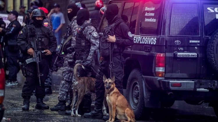 Venezuelan security forces stand guard after an explosion targeted President Nicolas Maduro