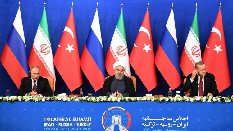 तेहरान में आयोजित(बायें से)  ईरान, रूस और तुर्की के राष्ट्रपति 