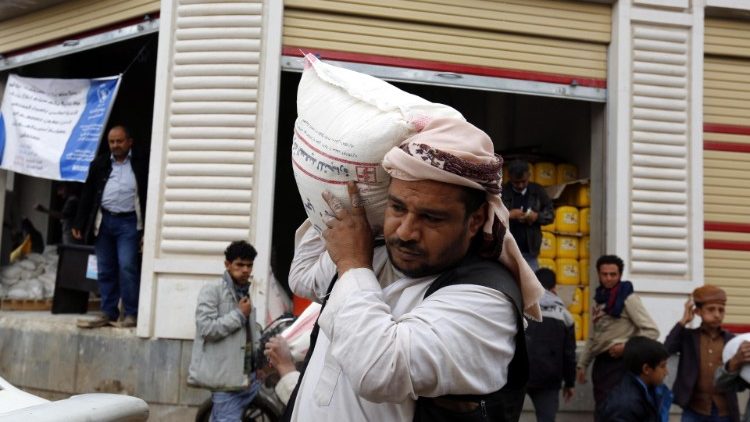 A Yemeni receiving UN food aid in Sana'a, Yemen.