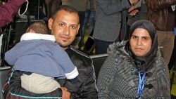 syrian-refugees-arrive-in-rome-1543580936267.jpg