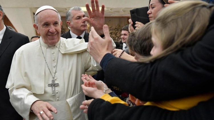Pope Francis greets pilgrims at a General Audience
