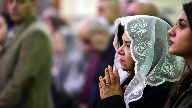 Christians in prayer in Baghdad, Iraq