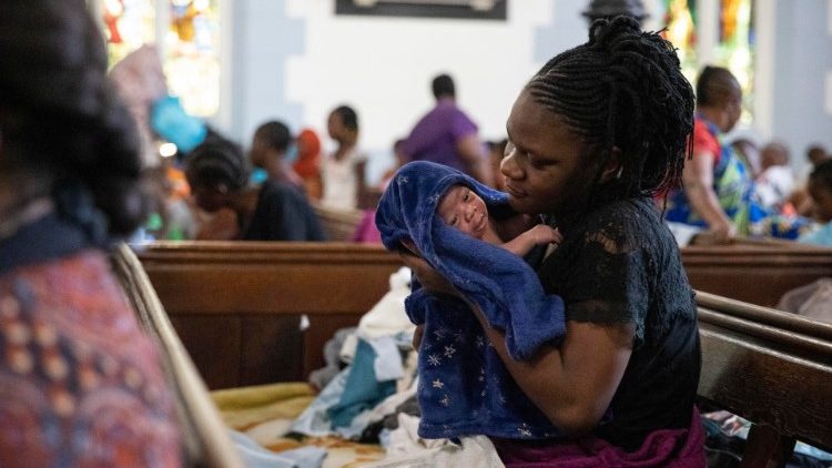 Des migrants africains dans une église méthodiste du Cap, en Afrique du Sud.