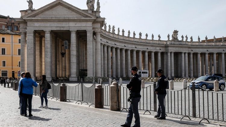 Italian police guard a shuttered St. Peter's Square