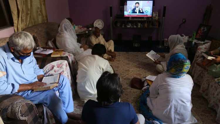 A Pakistani Christistian family in Karachi following an online prayer service during the Covid-19 lockdown. 