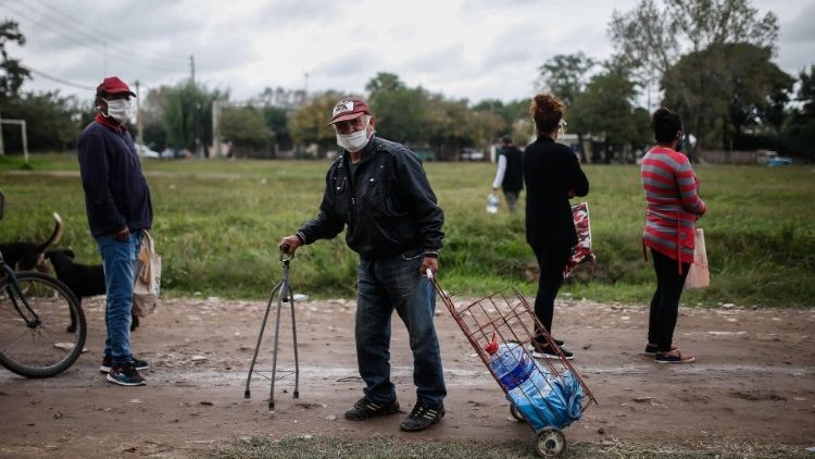 Argentinian people receive food during a day of quarantine