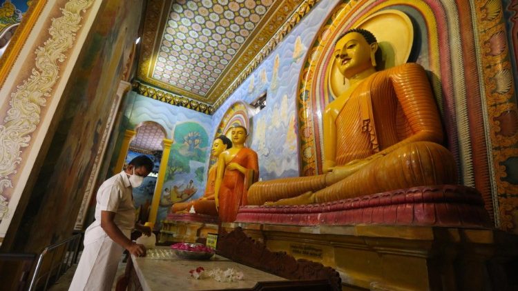 A Sri Lankan Buddhist inside the deserted Bellanwila temple in Colombo on May 7, 2020.