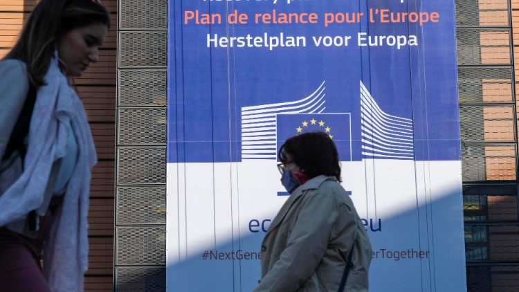 Placard highlighting the EU's recovery plan on the facade of the European Commission headquarters in Brussels