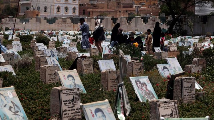 Yemenis at a graveyard in Sana'a