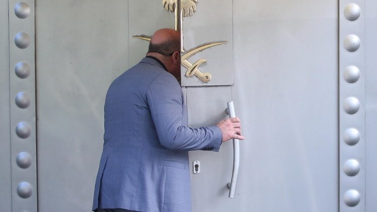 A Saudi official opens the door in the Saudi consulate in Istanbul