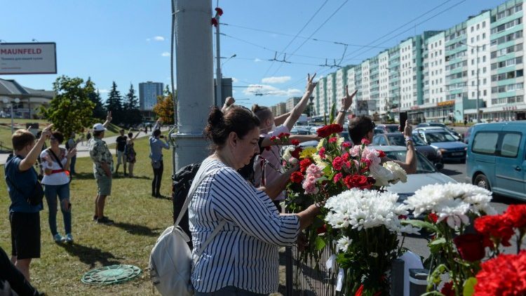 People lay flowers where a protester died in Minsk, Belarus