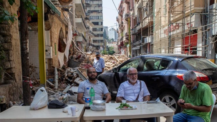 Beirut citizens have breakfast in the city's devastated port area  