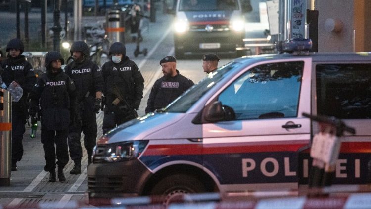 Police at the scene where a gunman opened fire on passersby in Austria, Vienna