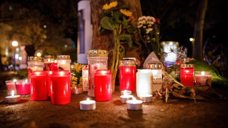 Candles and flowers near the crime scene after multiple shootings in Vienna