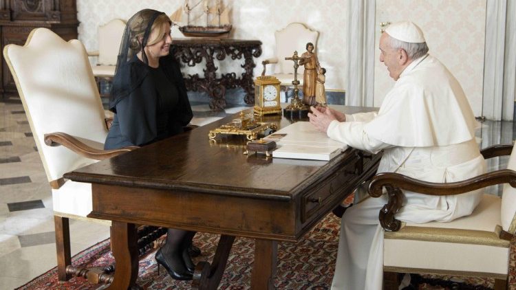 Pope Francis speaks with President Zuzana Čaputová during their audience in the Apostolic Library. 