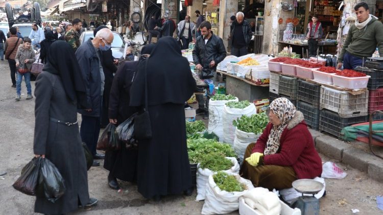 Mulheres num mercado sírio