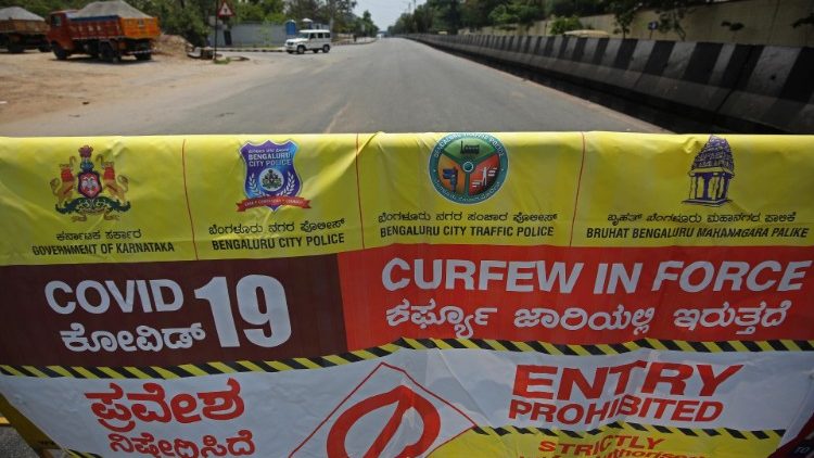 A police banner on a street in Bangalore, India, to enforce a 2-week lockdown against Covid-19 in Karnataka state. 
