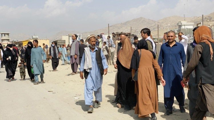 Afghans gather at Kabul's airport in hopes of fleeing the country
