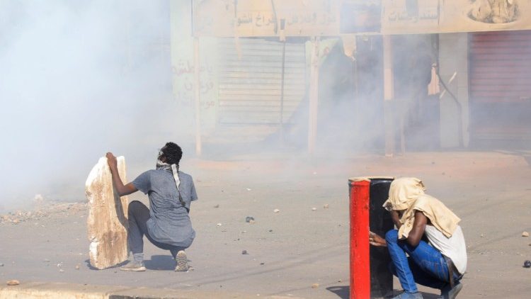 Sudanese protesters surrounded by tear gas on streets of Khartoum