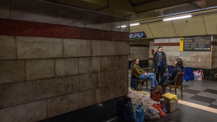 Ukrainian people stay at a subway station as Russia's attack on Ukraine continues