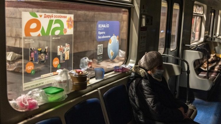 Ukrainian people stay at a subway station as Russia's attack on Ukraine continues