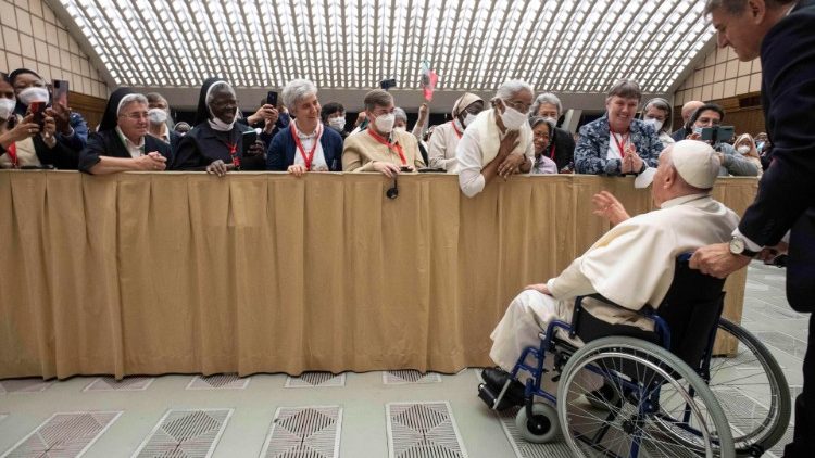 Pope Francis greets women religious from a wheelchair at a recent audience