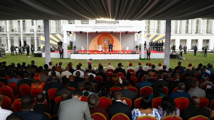 Diplomats, members of civil society and authorities listen to Pope Francis.