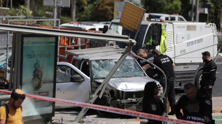 Israeli security forces investigate the site of a car ramming attack in Tel Aviv