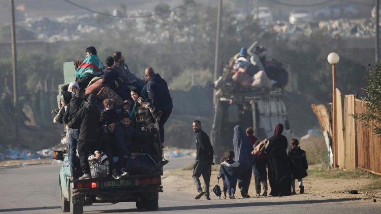 Palestinians evacuate a refugee camp as Israeli military operations in Gaza continue