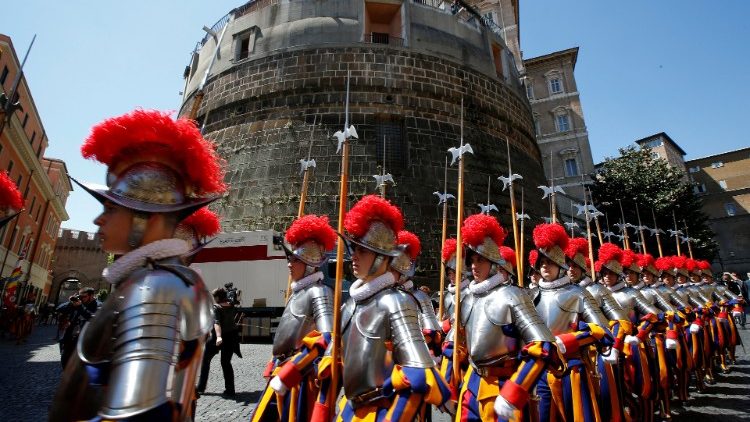 Swiss guards parade outside the Vatican Bank