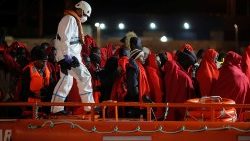 migrants-wait-to-disembark-from-a-rescue-boat-1545459831838.JPG