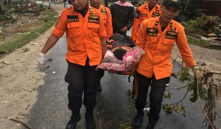rescue-team-members-carry-a-victim-on-a-stret-1545559435156.JPG