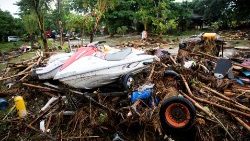 debris-are-seen-after-a-tsunami-hit-tanjung-l-1545569951558.JPG