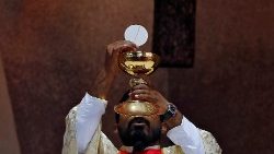 a-christian-priest-holds-a-chalice-and-the-eu-1545730432938.JPG