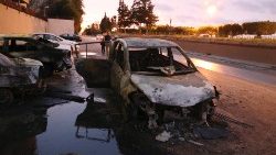 burned-cars-are-seen-at-the-site-of-the-headq-1545764631714.JPG