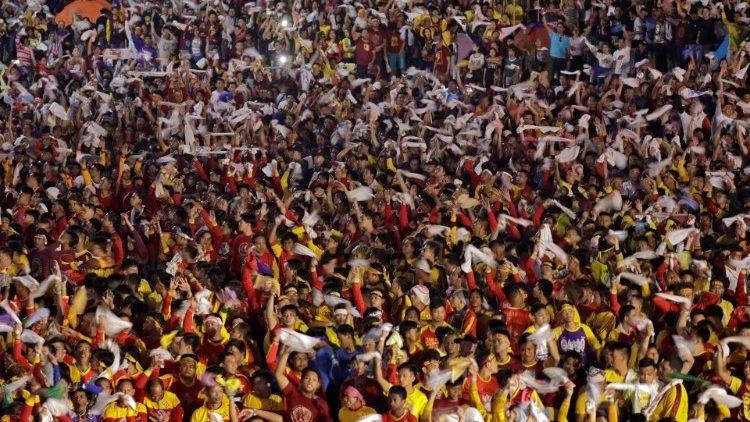 Catholic devotees flip their towels to celebrate the feast day of the Black Nazarene in Manila