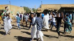 sudanese-demonstrators-march-along-the-street-1547218440899.JPG