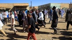 sudanese-demonstrators-march-along-the-street-1547219038063.JPG
