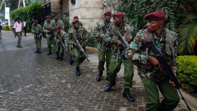 Members of security forces secure the scene where explosions and gunshots were heard at the Dusit hotel compound, in Nairobi