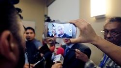 a-local-journalist-uses-his-mobile-phone-duri-1548540246338.JPG