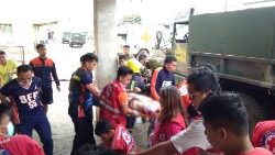 members-of-the-philippine-red-cross-carry-cas-1548580742091.JPG