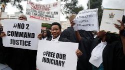 zimbabwean-lawyers-carry-placards-as-they-mar-1548772167997.JPG