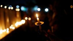 people-light-candles-during-a-vigil-following-1548804834313.JPG